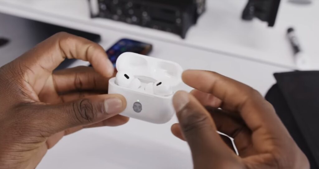 Man holds AirPods Pro 2 in his hands