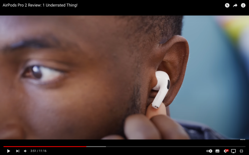 A man puts on AirPods Pro 2